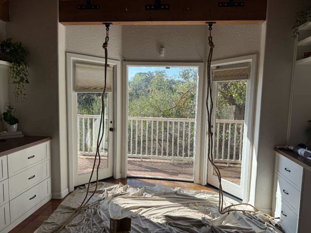 Swing ropes hung from the beam before the bench is attached