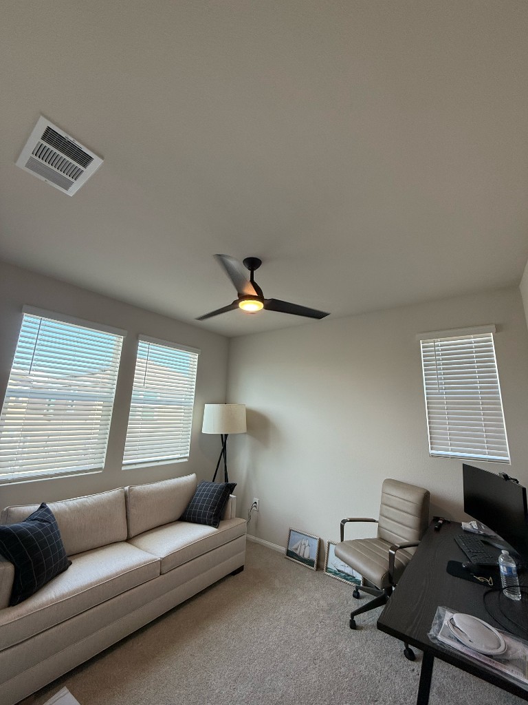 Finished three-blade ceiling fan with light in a Temecula office